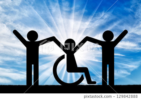 Happy disabled person in a wheelchair together with healthy people 129842888