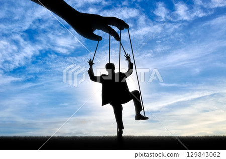 Man marionette. Manipulation concept Man marionette. Manipulation concept 129843062