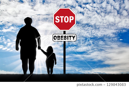 Fat father with a child and a sign of stop obesity Fat father with a child and a sign of stop obesity 129843083