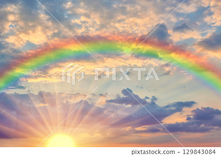 Beautiful evening sunset with rainbow 129843084