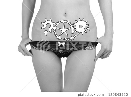 Woman's hands cover her stomach in pain 129843320