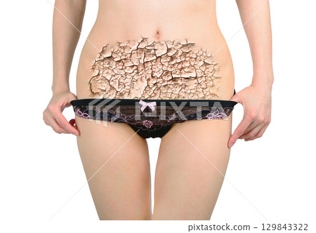 Woman's hands cover her stomach in pain 129843322