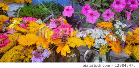 A Vibrant Floral Arrangement Filled with Many Colorful Flowers for All to Enjoy and Admire A Vibrant Floral Arrangement Filled with Many Colorful Flowers for All to Enjoy and Admire 129843473