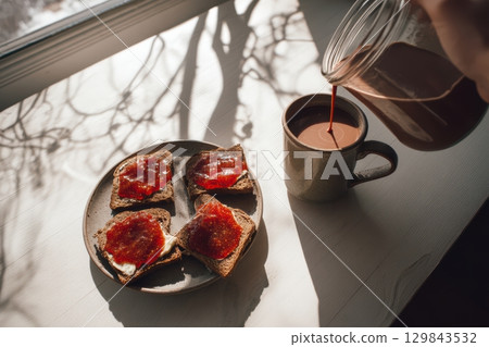 Enjoy a Warm Breakfast featuring Jam Toast along with a Hot Drink for a perfect start 129843532