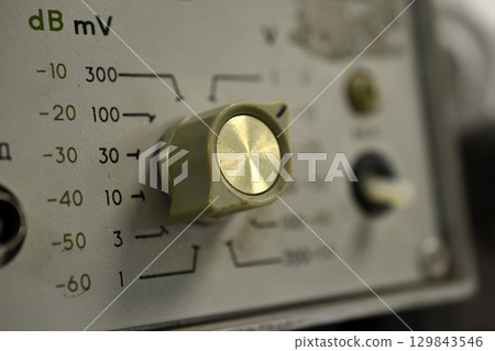 A millivoltmeter. Electronic devices. Voltage meter. An old electronic device. A millivoltmeter. Electronic devices. Voltage meter. An old electronic device. 129843546