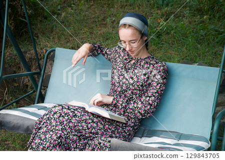 Pretty girl reading a book Pretty girl reading a book 129843705