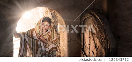 Young girl at the door look inside 129843712