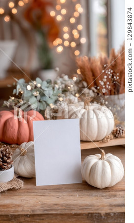 Rustic autumn arrangement with pumpkins and blank card. 129843874