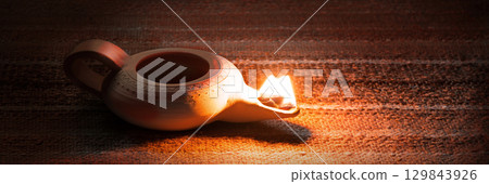Ancient lamp shines in the dark Ancient lamp shines in the dark 129843926
