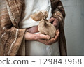 Male hands holding a bag 129843968