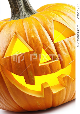 A brilliantly glowing Halloween JackoLantern featuring a delightfully spooky expression 129844742