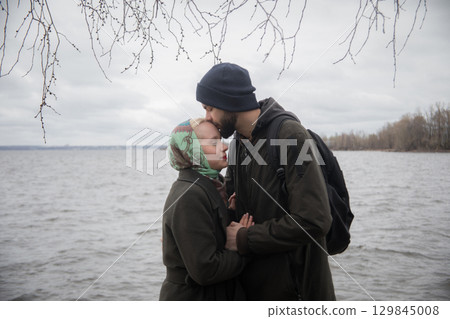 Lovers together. Man and woman outdoors portrait Lovers together. Man and woman outdoors portrait 129845008