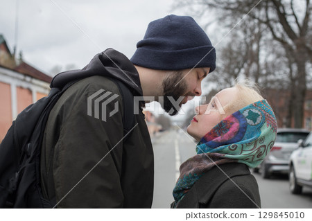 Adorable lovers man and woman outdoors portrait Adorable lovers man and woman outdoors portrait 129845010