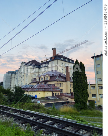 Vysoke Tatry, Slovakia - August 4, 2025: View of railway tracks and houses from the city streets. 129845479