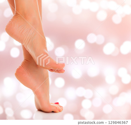 Woman feet closeup on an abstract background 129846367