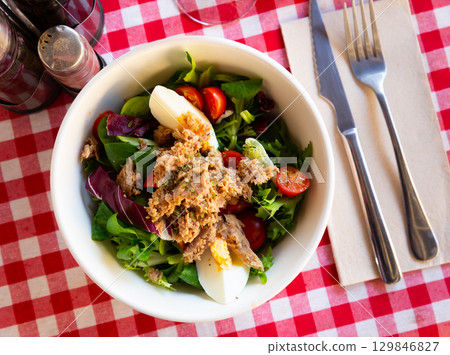 Salad with eggs, tuna and cherry tomatoes Salad with eggs, tuna and cherry tomatoes 129846827