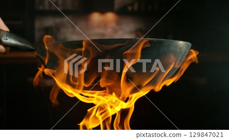 Freeze Motion of Flying Asian Wok Ingredients with Fire Flames 129847021
