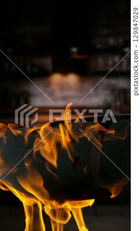 Freeze Motion of Flying Asian Wok Ingredients with Fire Flames 129847029