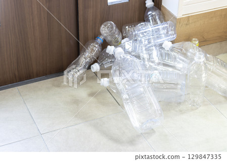 Many empty plastic bottles left at the entrance Many empty plastic bottles left at the entrance 129847335