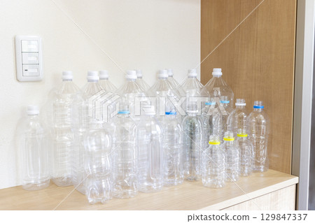 Many empty plastic bottles left at the entrance Many empty plastic bottles left at the entrance 129847337