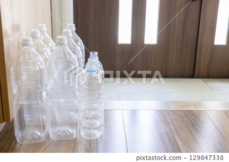 Many empty plastic bottles left at the entrance Many empty plastic bottles left at the entrance 129847338