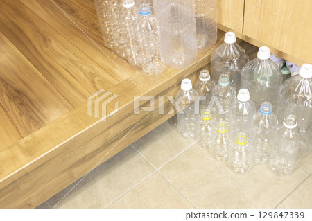 Many empty plastic bottles left at the entrance 129847339