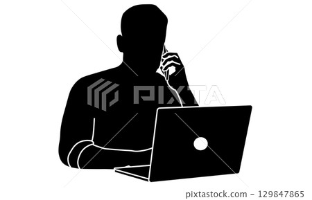 Silhouette of a man working on a laptop and talking on the phone 129847865
