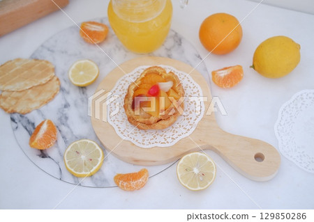 Tropical Fruit Dessert in Soft Pastel Setting 129850286