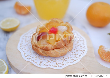 Tropical Fruit Dessert in Soft Pastel Setting 129850293