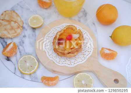 Tropical Fruit Dessert in Soft Pastel Setting Tropical Fruit Dessert in Soft Pastel Setting 129850295