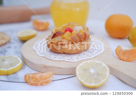 Tropical Fruit Dessert in Soft Pastel Setting 129850300