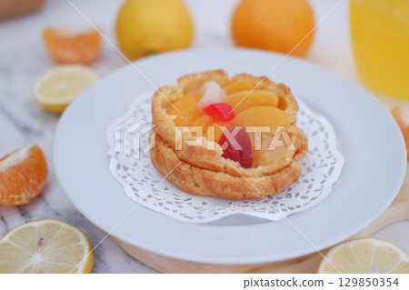 Tropical Fruit Dessert in Soft Pastel Setting Tropical Fruit Dessert in Soft Pastel Setting 129850354