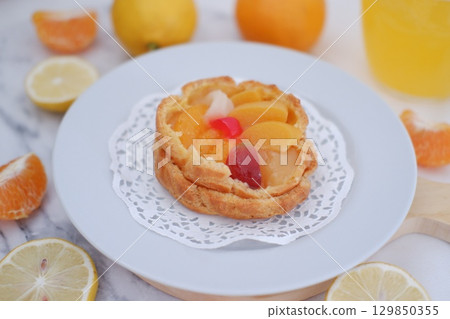 Tropical Fruit Dessert in Soft Pastel Setting Tropical Fruit Dessert in Soft Pastel Setting 129850355