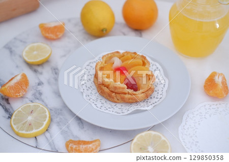Tropical Fruit Dessert in Soft Pastel Setting Tropical Fruit Dessert in Soft Pastel Setting 129850358