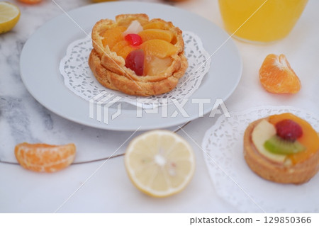 Tropical Fruit Dessert in Soft Pastel Setting Tropical Fruit Dessert in Soft Pastel Setting 129850366