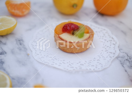 Tropical Fruit Dessert in Soft Pastel Setting Tropical Fruit Dessert in Soft Pastel Setting 129850372