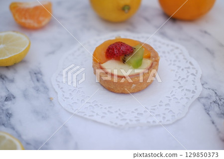 Tropical Fruit Dessert in Soft Pastel Setting 129850373