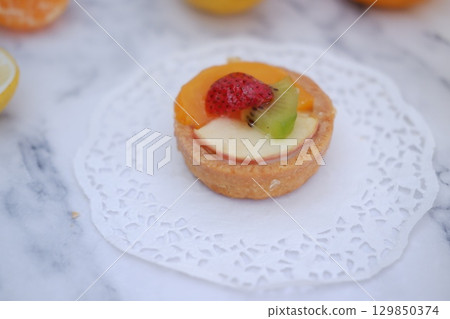 Tropical Fruit Dessert in Soft Pastel Setting Tropical Fruit Dessert in Soft Pastel Setting 129850374