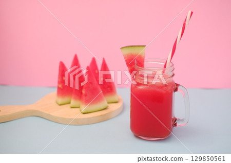 Summer Refreshment Watermelon Drink with Fruit Garnish Summer Refreshment Watermelon Drink with Fruit Garnish 129850561