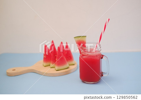 Summer Refreshment Watermelon Drink with Fruit Garnish Summer Refreshment Watermelon Drink with Fruit Garnish 129850562