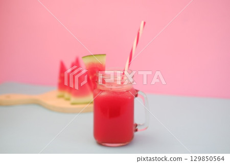 Summer Refreshment Watermelon Drink with Fruit Garnish Summer Refreshment Watermelon Drink with Fruit Garnish 129850564