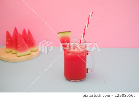 Summer Refreshment Watermelon Drink with Fruit Garnish Summer Refreshment Watermelon Drink with Fruit Garnish 129850565
