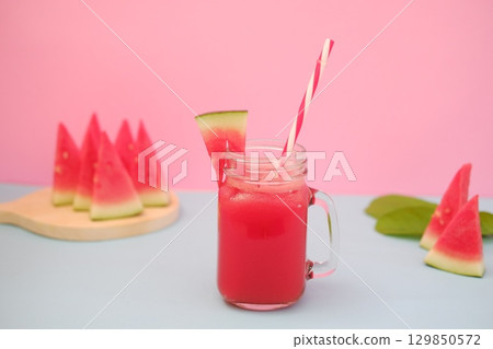 Summer Refreshment Watermelon Drink with Fruit Garnish Summer Refreshment Watermelon Drink with Fruit Garnish 129850572