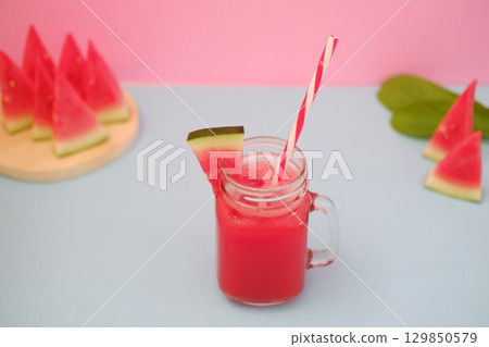 Summer Refreshment Watermelon Drink with Fruit Garnish Summer Refreshment Watermelon Drink with Fruit Garnish 129850579