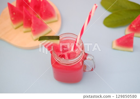 Summer Refreshment Watermelon Drink with Fruit Garnish Summer Refreshment Watermelon Drink with Fruit Garnish 129850580