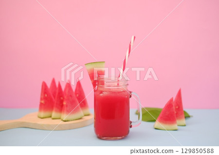 Summer Refreshment Watermelon Drink with Fruit Garnish Summer Refreshment Watermelon Drink with Fruit Garnish 129850588