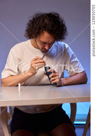 The Innovative Smartphone Cleaning Device is Being Demonstrated During Use and Functionality The Innovative Smartphone Cleaning Device is Being Demonstrated During Use and Functionality 129850705