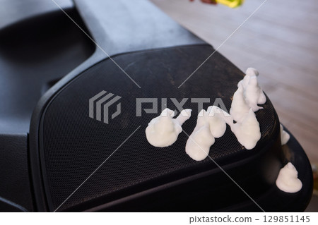 Cleaning with Spray in a Modern Workspace Setup for Enhanced Productivity and Hygiene 129851145