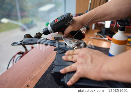 Careful precision is essential when installing a car headlight assembly for optimal performance 129851691