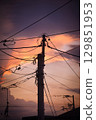 Landscape with electric poles at dusk 129851953